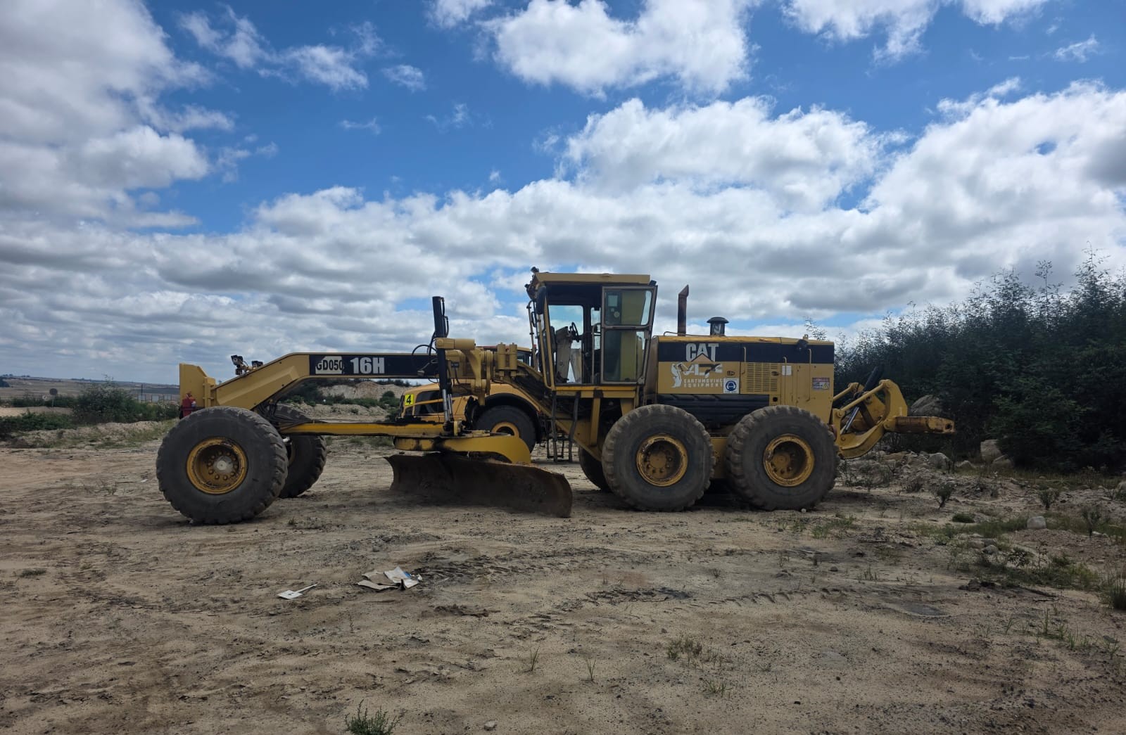 Road grader working on site